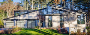 side of contemporary house with 3 car garage
